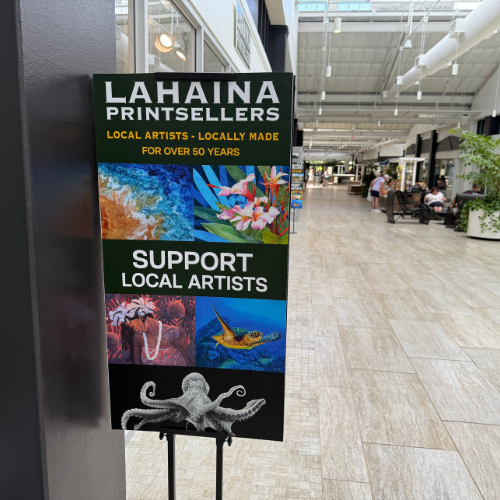 Signs in The Cannery highlighting local shops and services that support Maui small businesses.